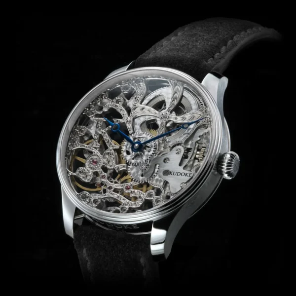 Kudoke HS1 front view displaying hand-engraved skeleton dial, silver-white rhodium bridges and onion crown