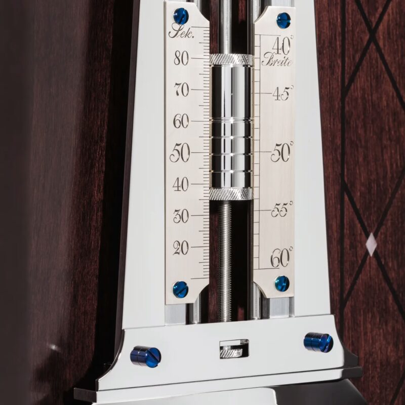 Precision pendulum adjustment scale and regulator detail inside wooden case