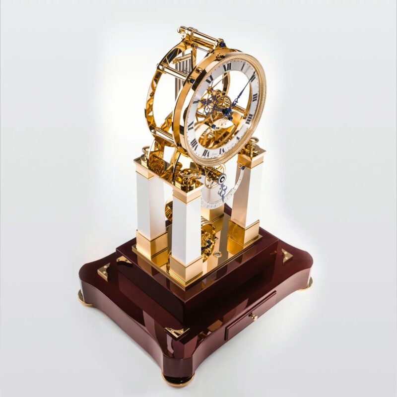 Rear angled view of handcrafted table clock showcasing movement structure and polished wood base
