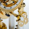 Luxury table clock winding key and lower dial mechanism detail